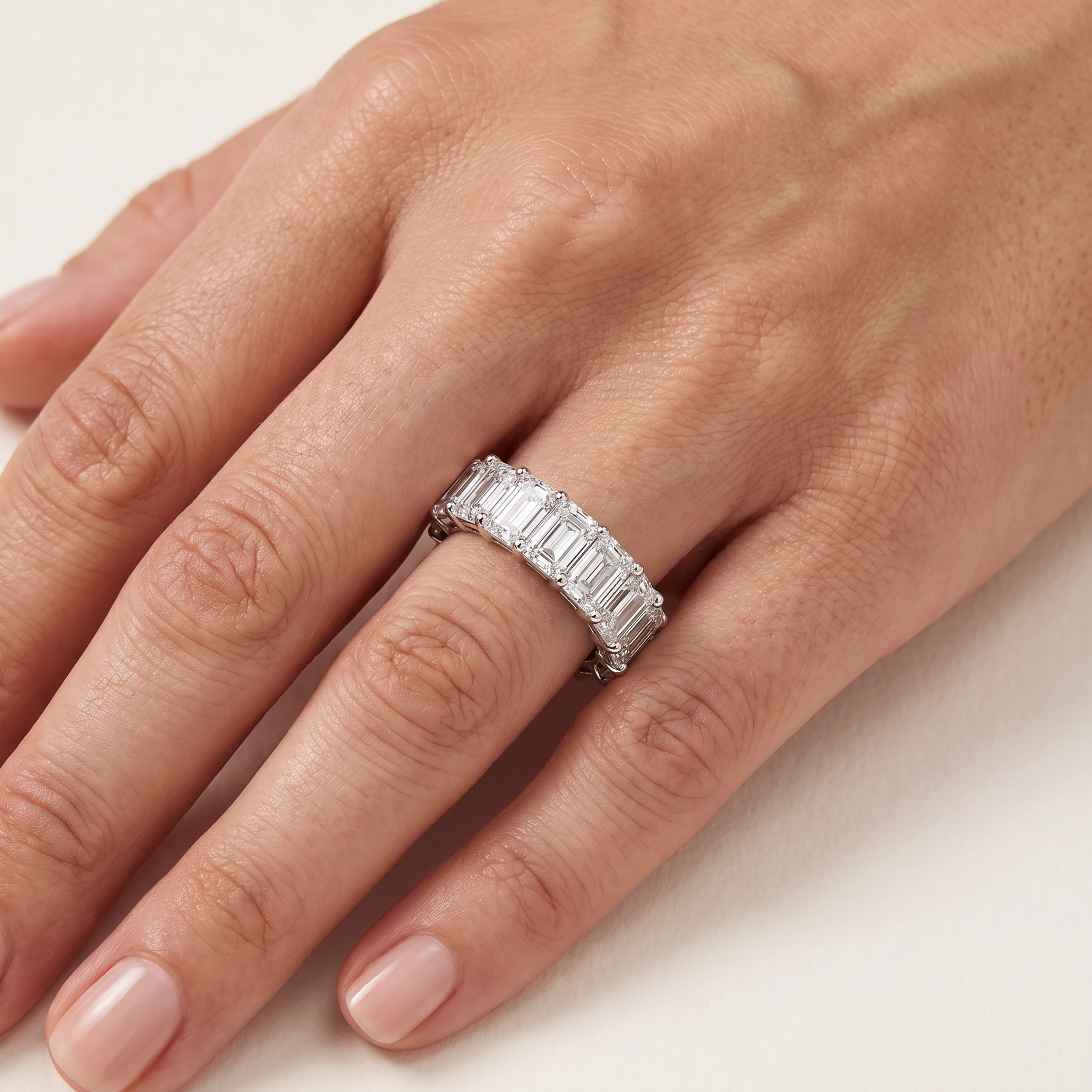 Emerald-Cut Lab-Grown Diamond Full Eternity Ring — worn on an adult hand; AI-generated style illustration