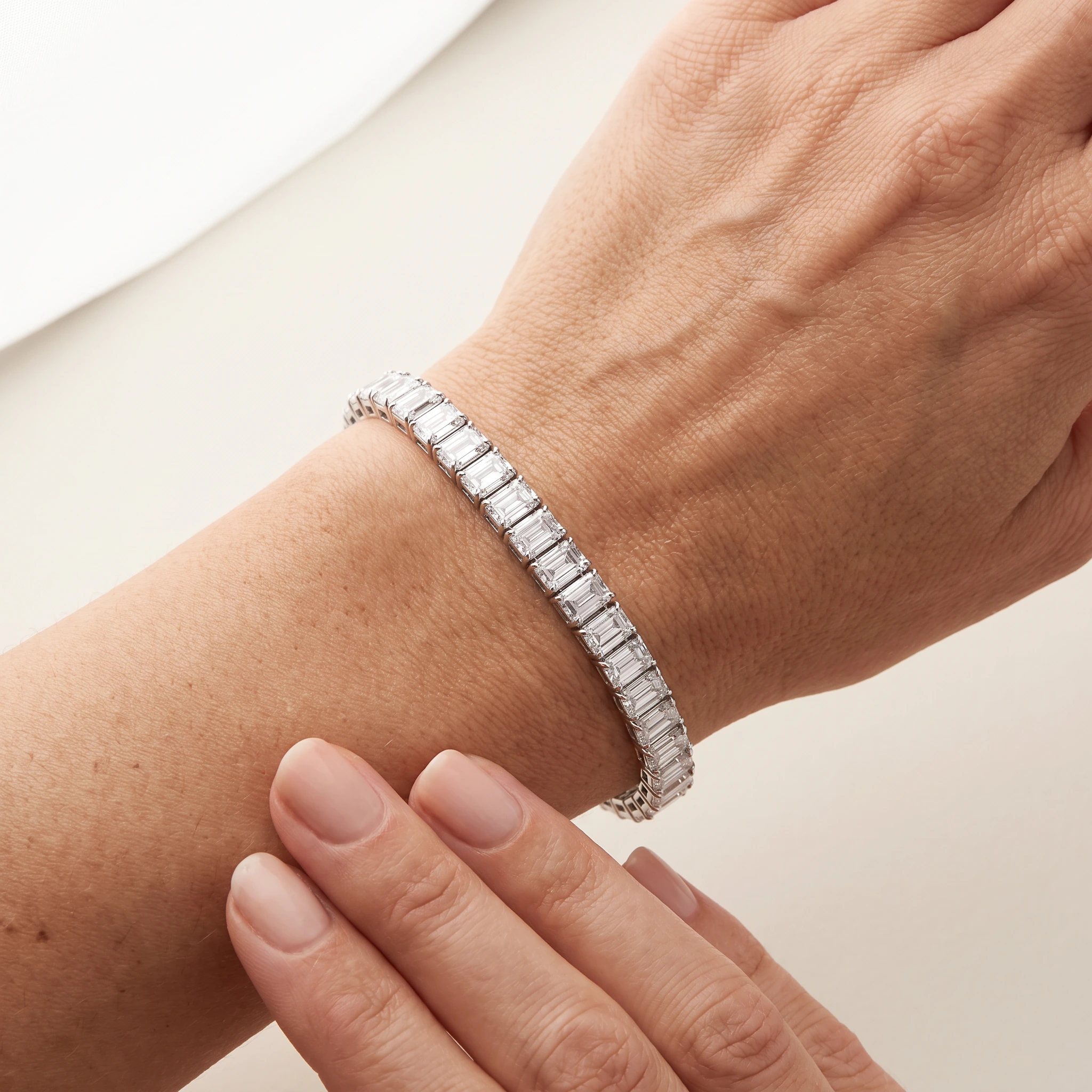 Emerald-Cut Lab-Grown Diamond Tennis Bracelet — worn on an adult wrist; AI-generated style illustration